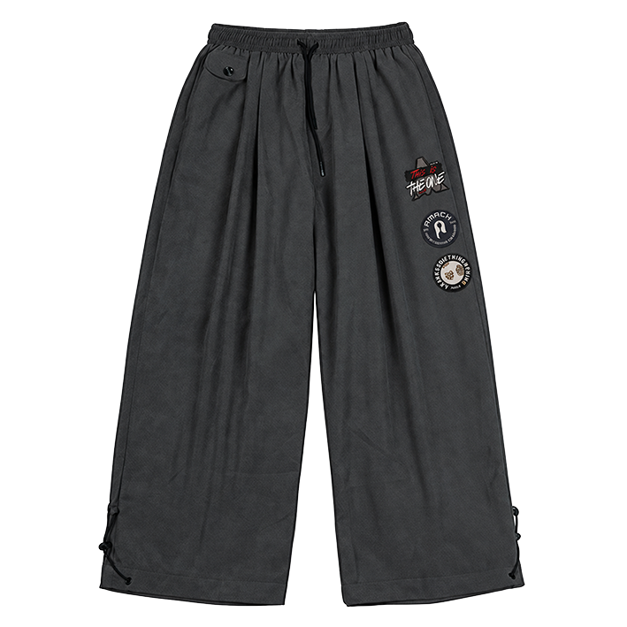 AMACH By Any Means grey baggy cord trousers with embroidered and woven patches, front