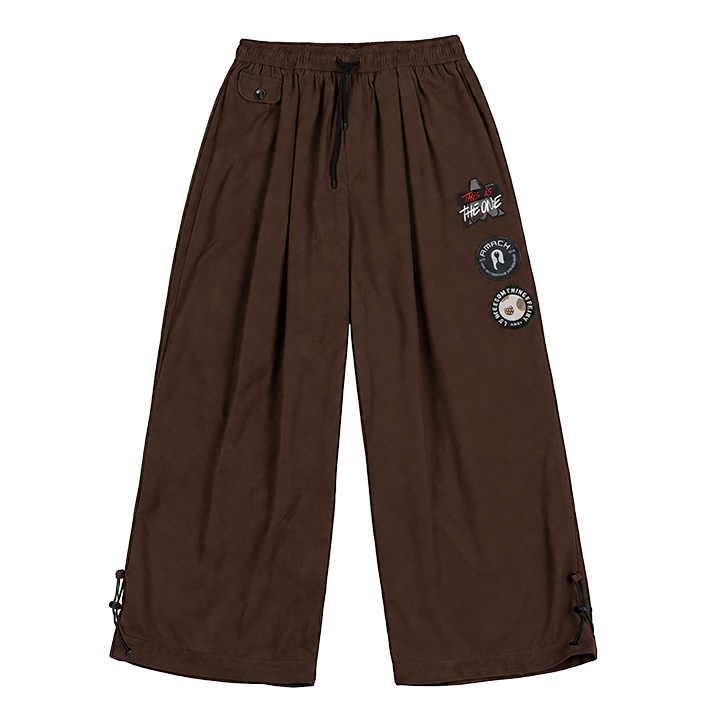 AMACH By Any Means brown baggy cord trousers with embroidered and woven patches, front