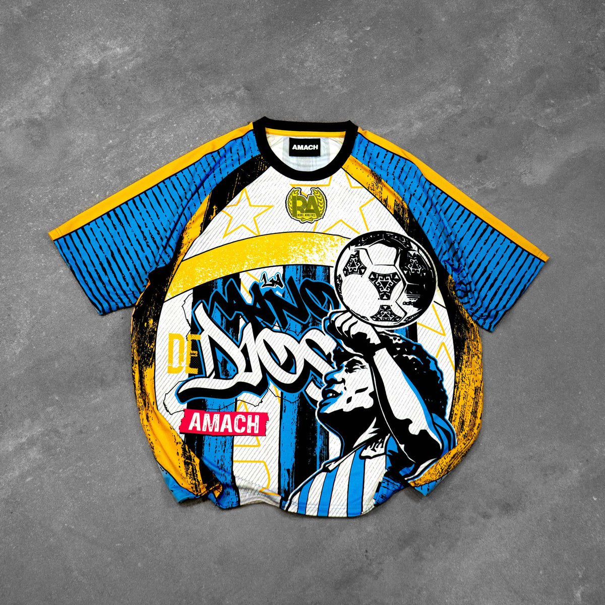 AMACH Rebel Athletics Maradona jersey, blue, white and yellow 90s-style football shirt, front flat lay