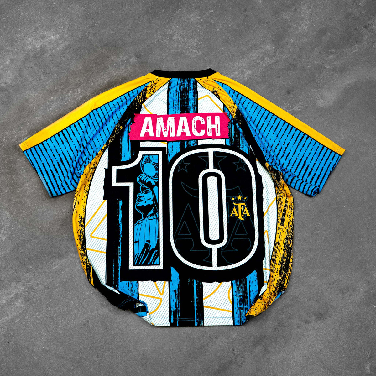 AMACH Rebel Athletics Maradona jersey, blue, white and yellow 90s-style football shirt, back flat lay with number 10