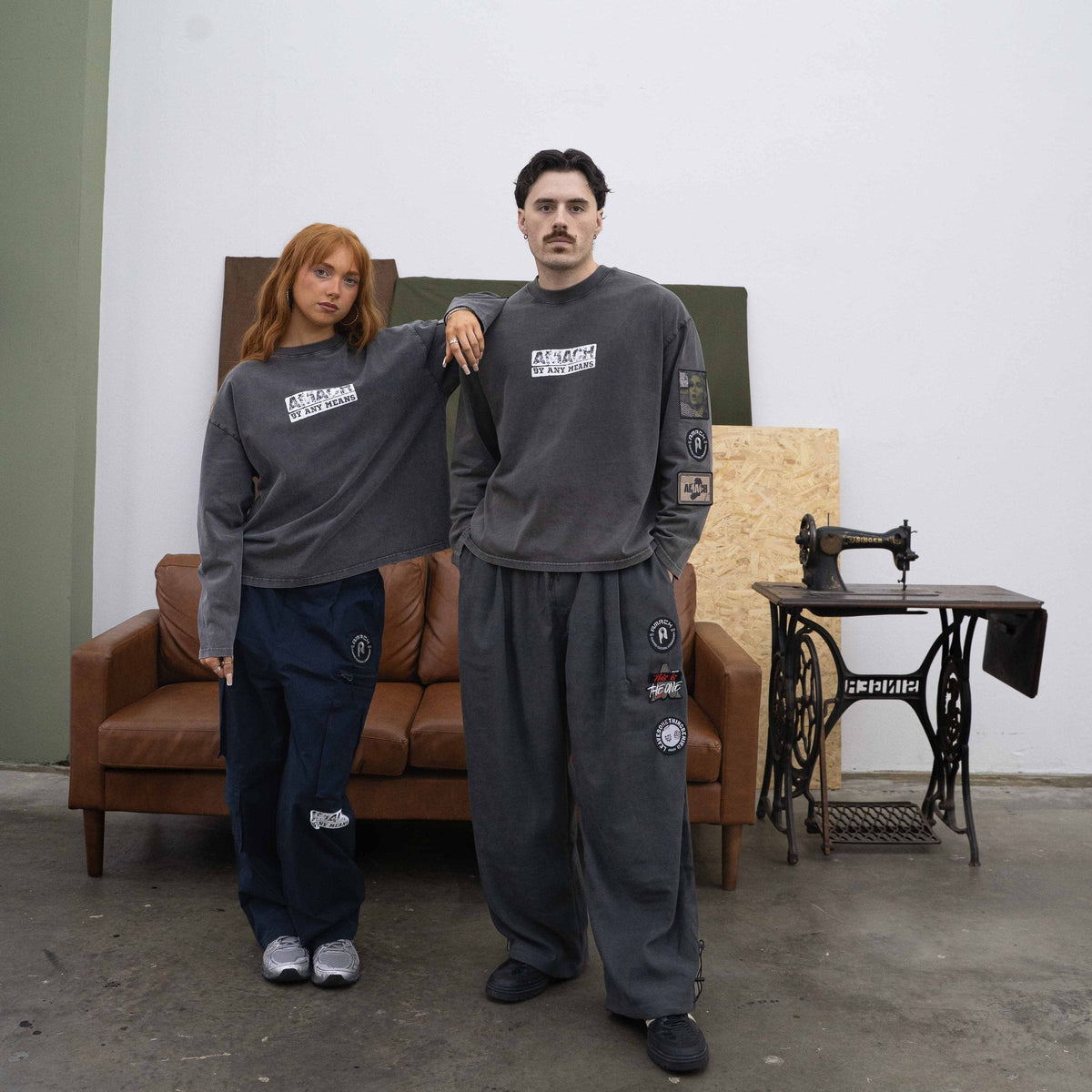 AMACH By Any Means vintage black long-sleeve tee with grey patch trousers
