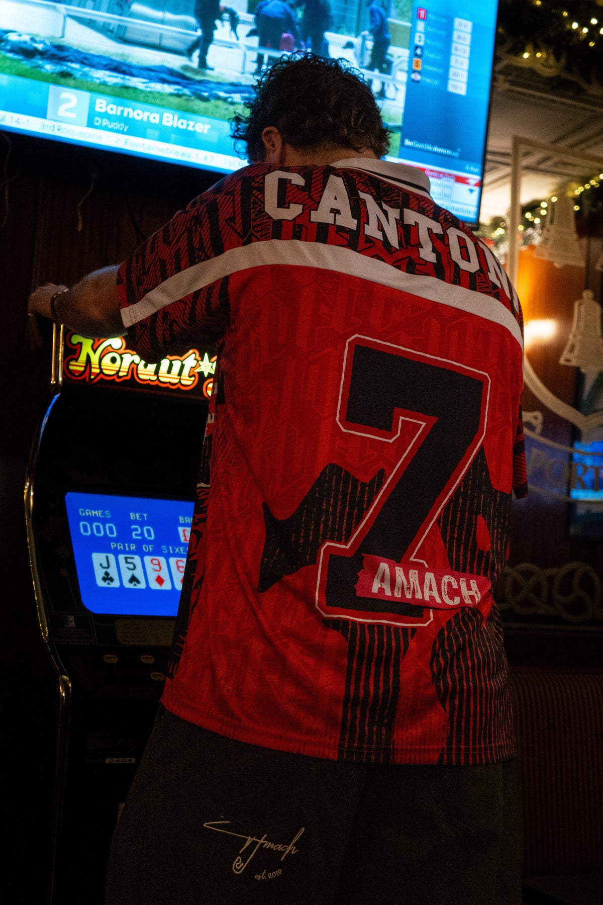 Back of the AMACH Rebel Athletics Cantona jersey, number 7, shot at Porters Bar, Derry